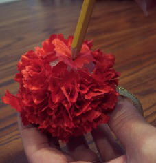 Use a pencil to poke scrap fabric into a Styrofoam ball to make an easy kids Christmas craft.